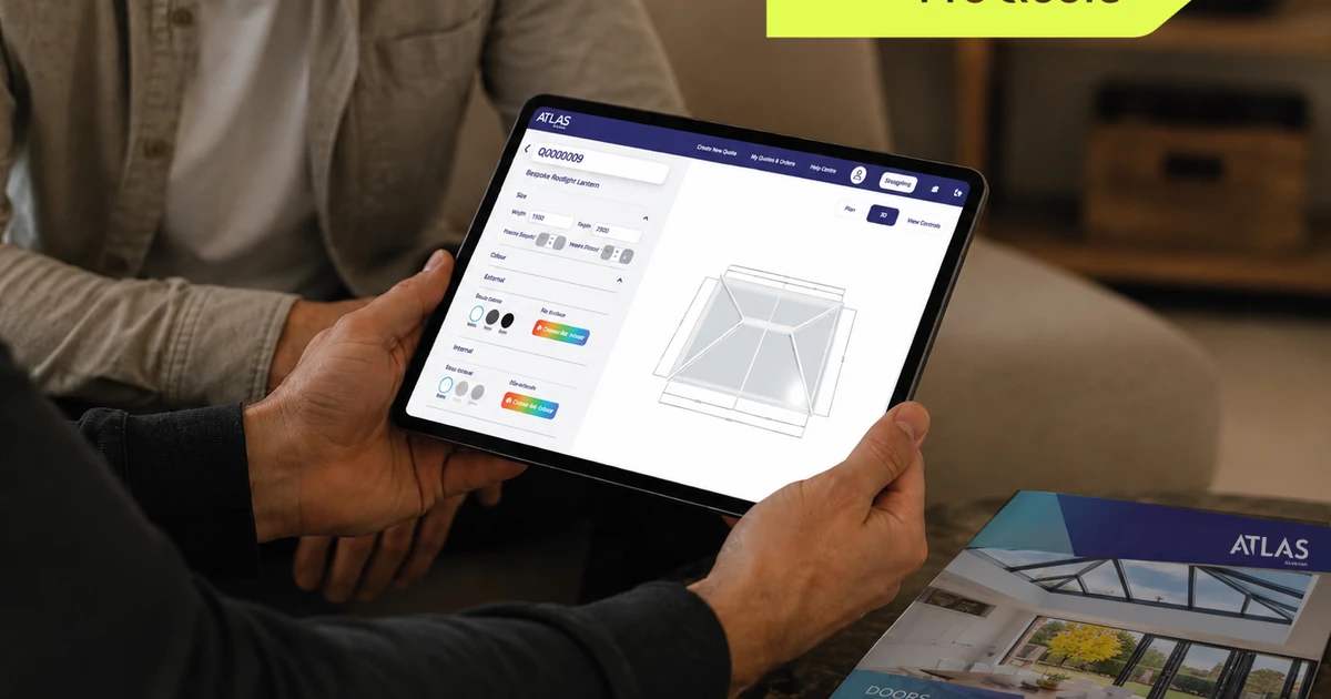 Two people reviewing the Atlas ProQuote roofing configuration and quoting platform on a tablet in a casual setting