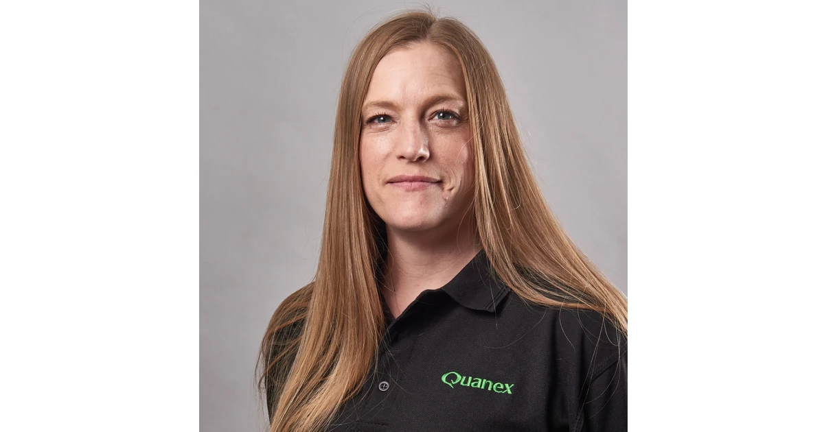 Helen Grice, Commercial Enablement Manager at Quanex, wearing a black Quanex polo shirt, facing camera against a neutral background
