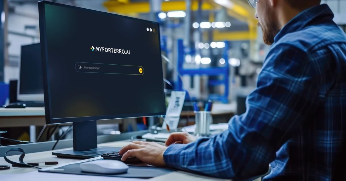 Person using MyForterro.ai AI platform displayed on computer screen in industrial workspace
